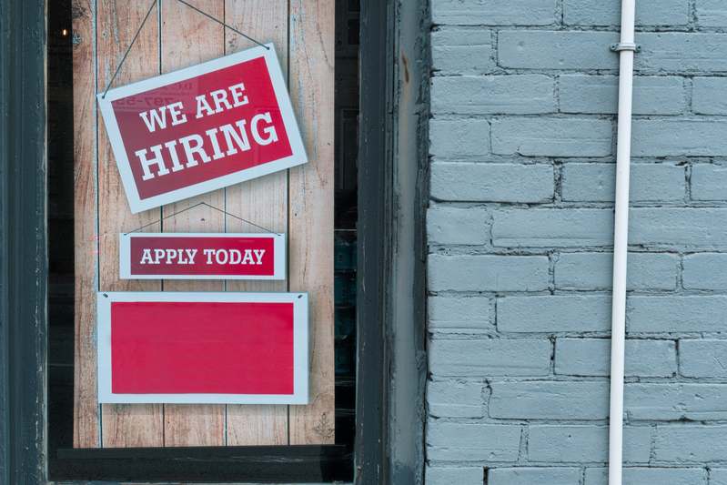 Diverse group practicing job interviews in a modern co-working space